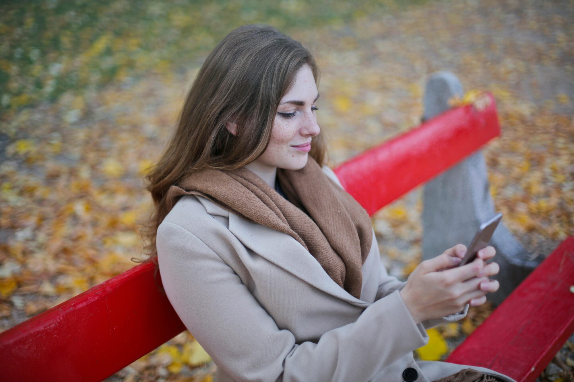 Woman reading mobile content on her phone