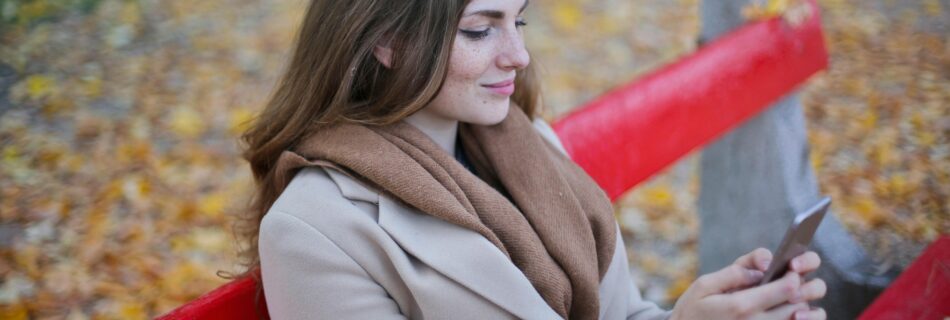 Woman reading mobile content on her phone